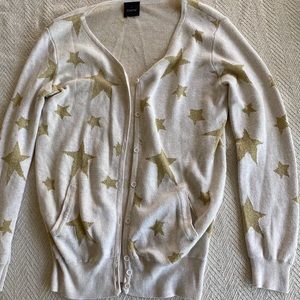 Off-white sweater with gold stars